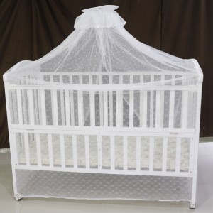 White wooden baby bed